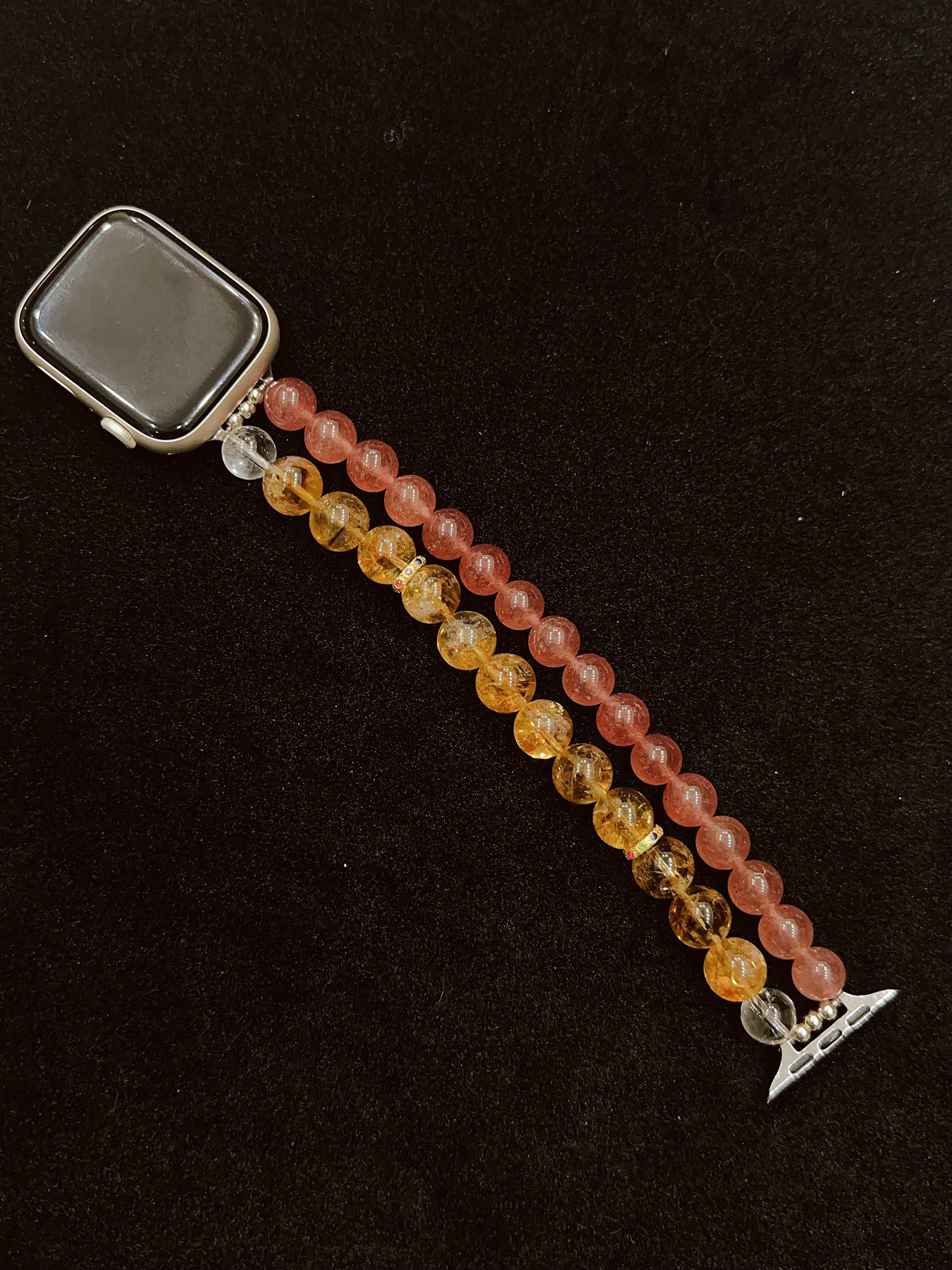 Beaded watch strap with a dark background