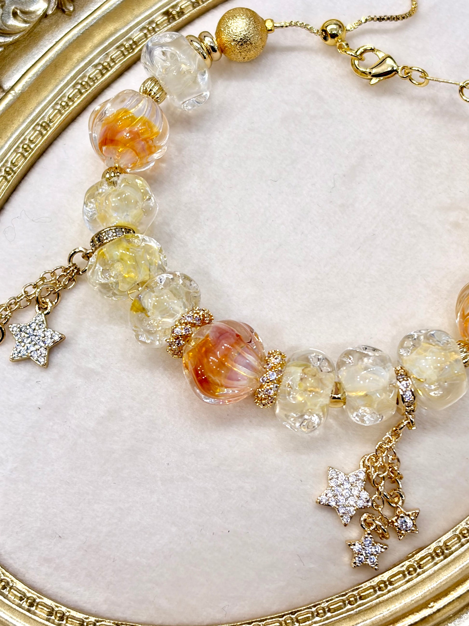 Amber bracelet with cascading CZ star drop charms — fairy cottagecore jewellery