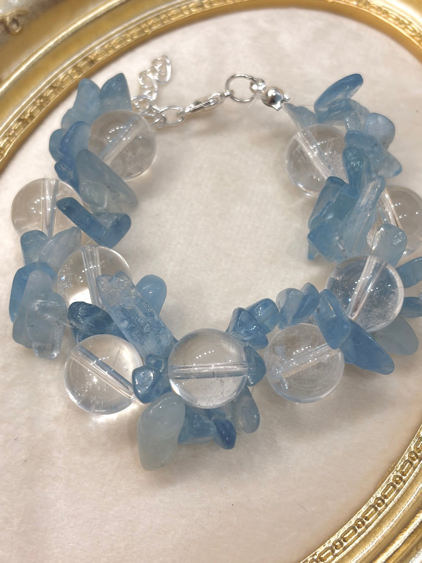Close-up of raw aquamarine chips and 12mm clear quartz round beads with silver lobster clasp — adjustable handmade crystal bracelet