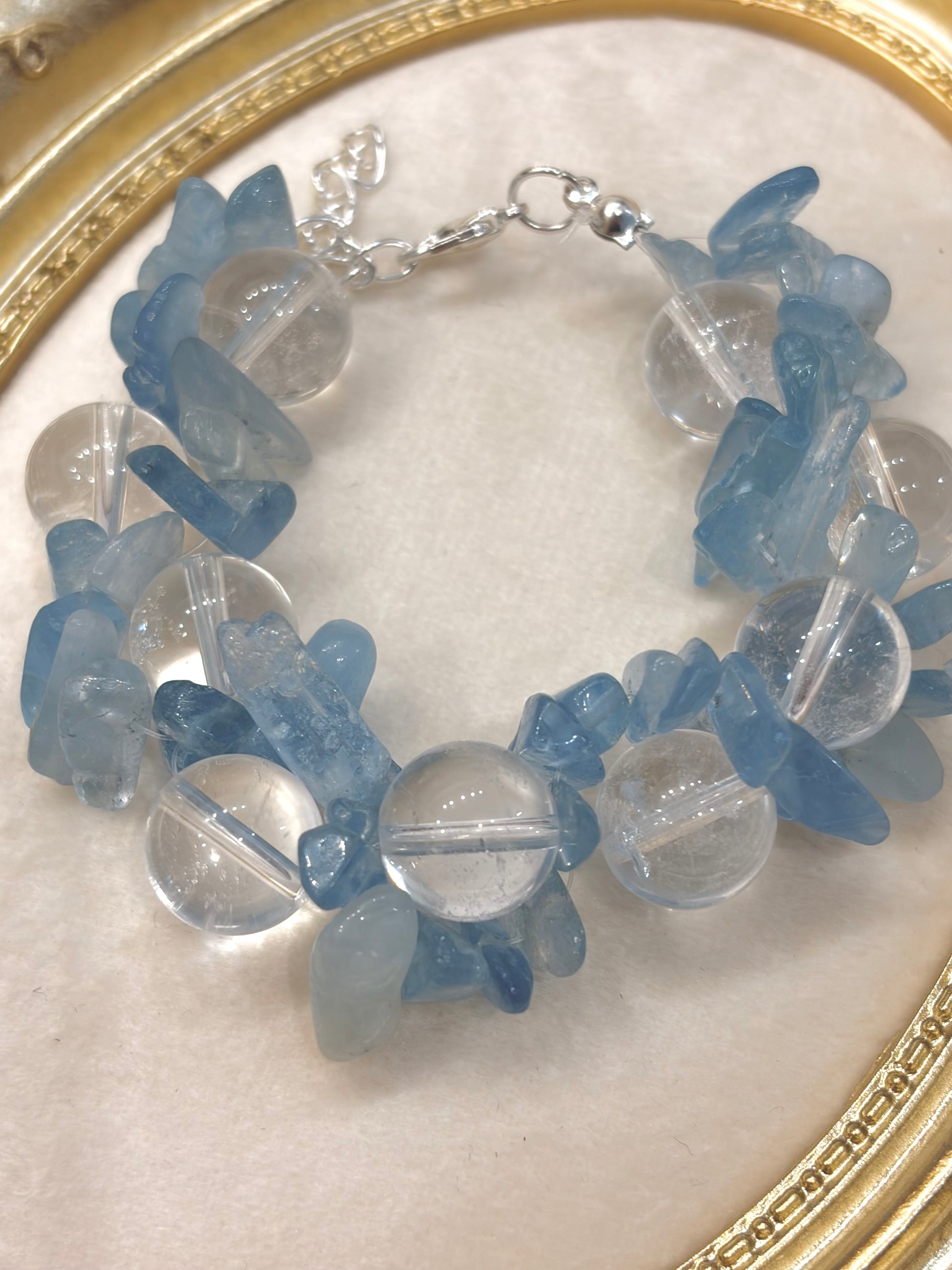 Close-up of raw aquamarine chips and 12mm clear quartz round beads with silver lobster clasp — adjustable handmade crystal bracelet