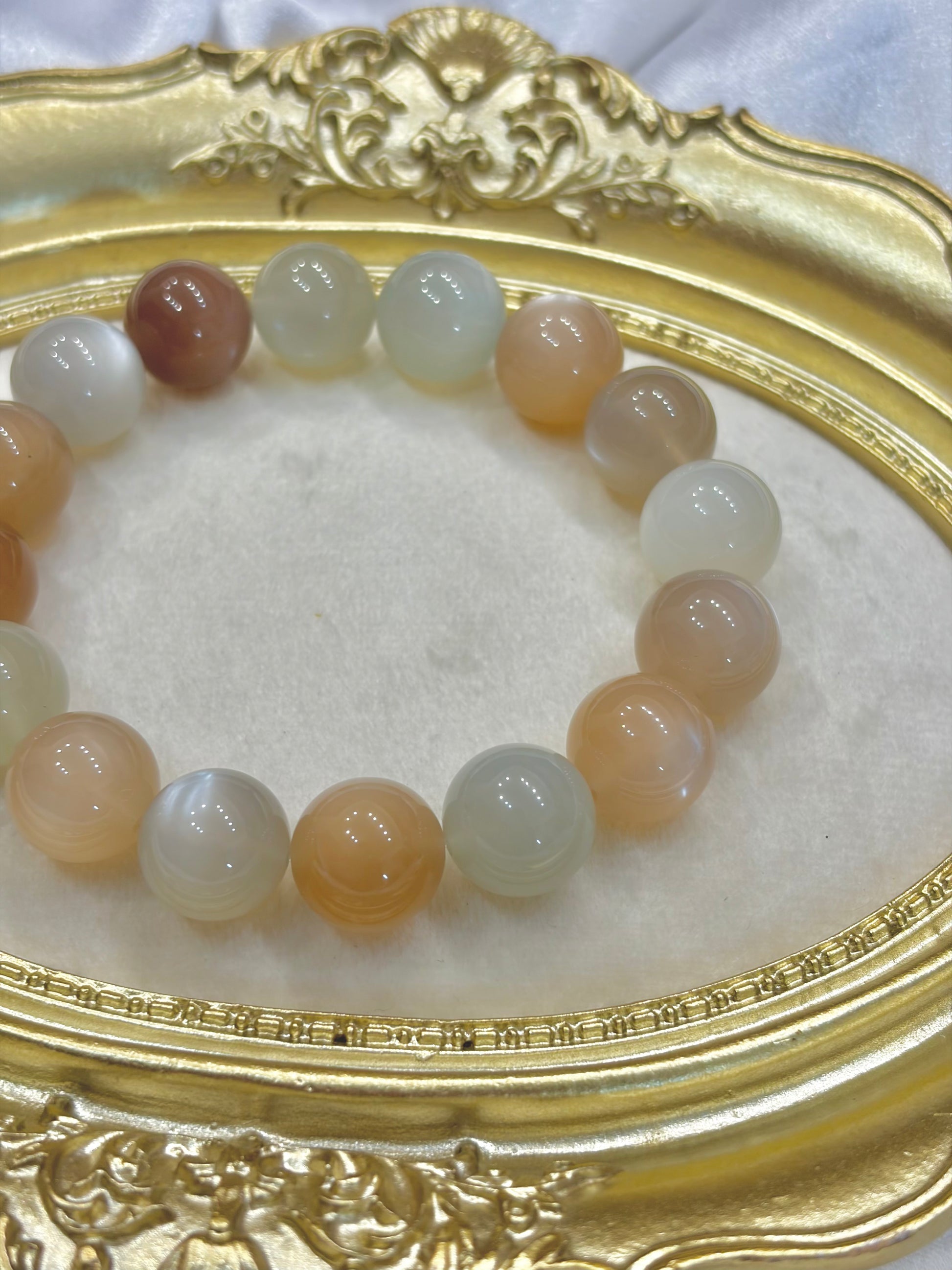 Multicolored beaded bracelet on a decorative gold tray