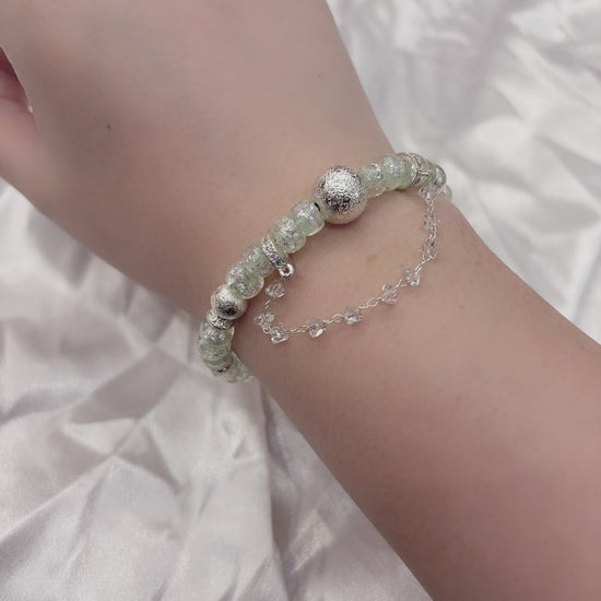 Adjustable mint green glass bead bracelet catching light — mermaid coastal jewellery Australia New Zealand
