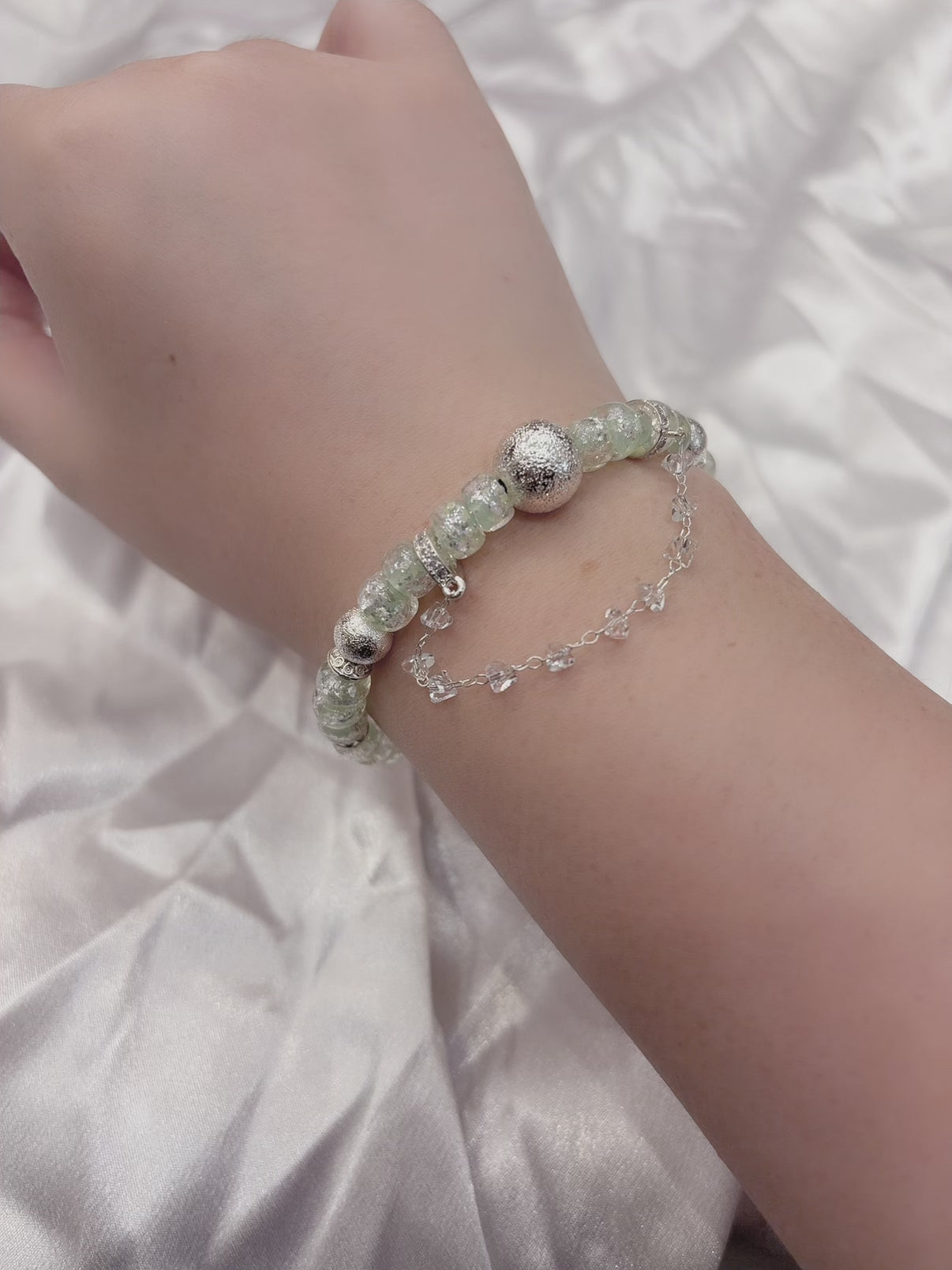 Adjustable mint green glass bead bracelet catching light — mermaid coastal jewellery Australia New Zealand